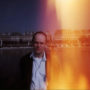 Parisian Sunset - Here's a picture of Todd, taken on his recent trip to Paris. Note the huge orange streak. This was not a mistake caused by Todd's shitty camera. It was an intentional choice made by Todd, a visionary photographic subject.